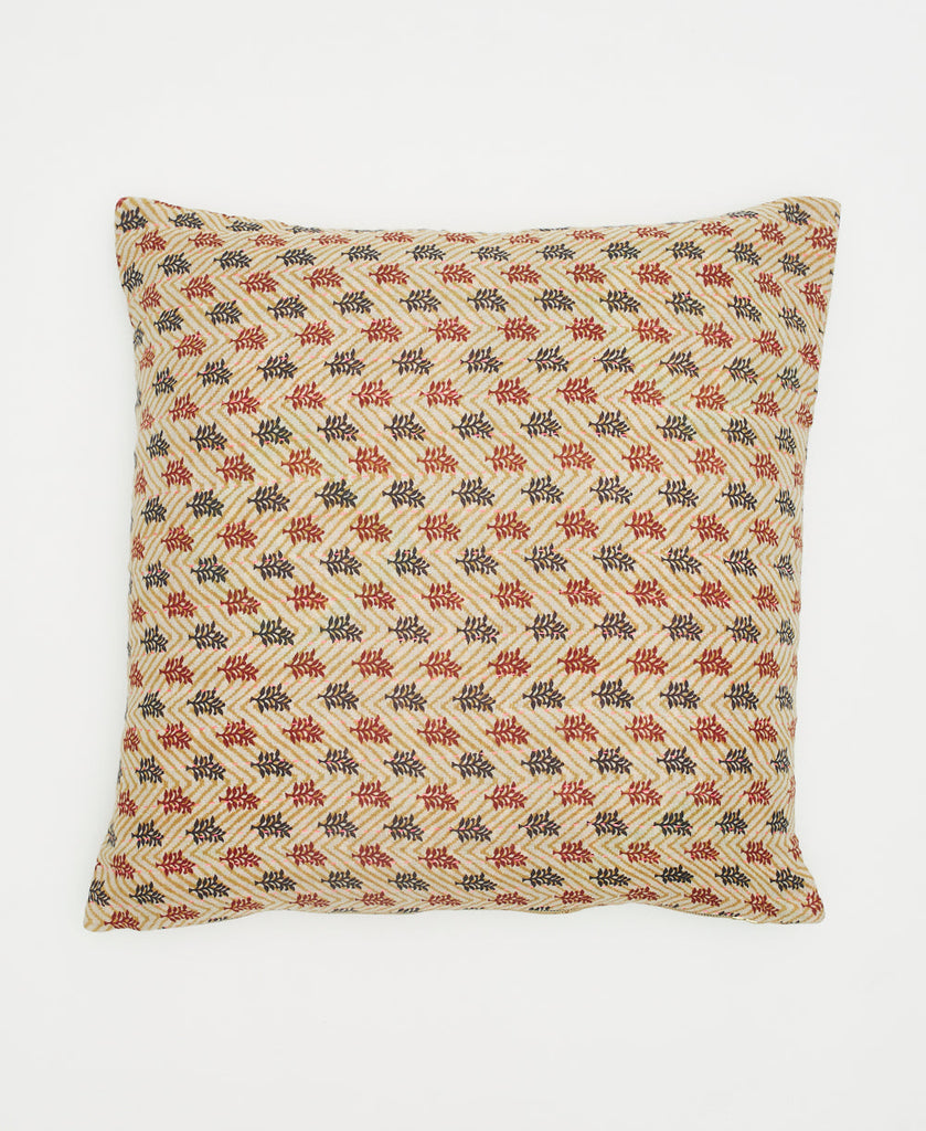 beige sustainable cotton throw pillow with black and red branches and traditional kantha stitching 