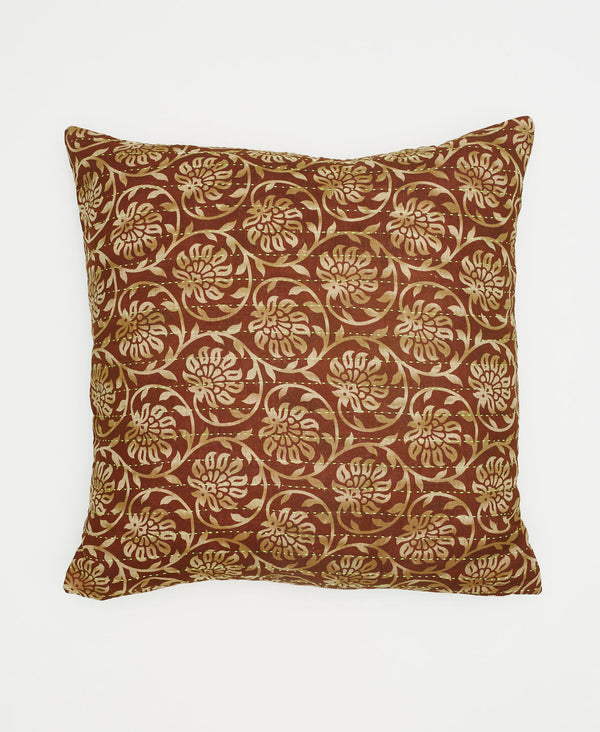 brown cotton throw pillow with beige swirling flowers and vines 