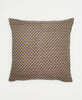 beige sustainable throw pillow with small green flowers