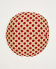 Red and brown polka-dot round throw pillow featuring white traditional kantha hand stitching 