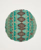 Abstaract blue and tan round throw pillow featuring traditional kantha hand stitching in pink 