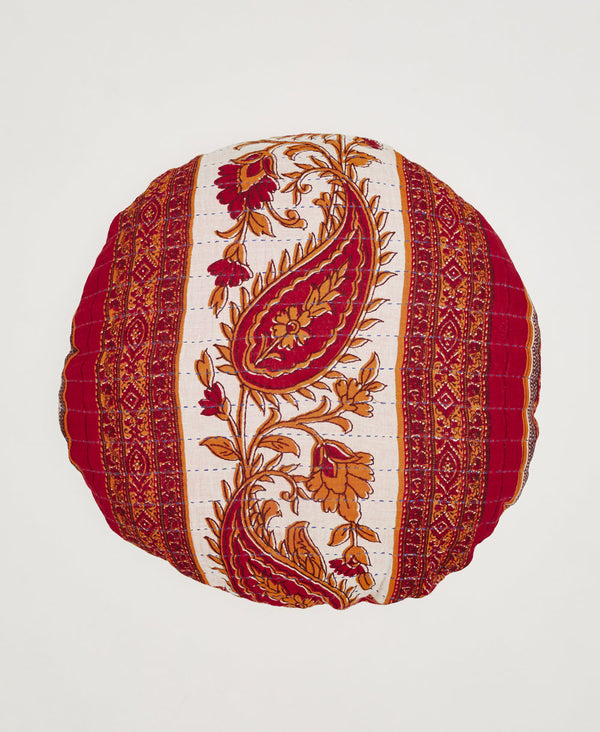 Red, orange, and white round artisan made throw pillow 