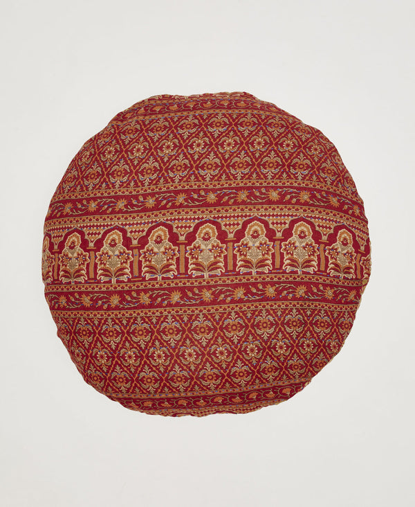 Deep red, orange and cream ornately patterned round throw pillow 