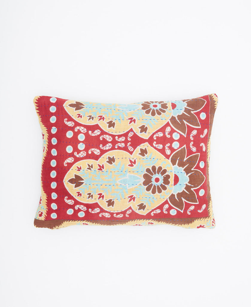 Red, cream, blue, and brown abstract print small throw pillow 