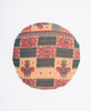 red, green, and tan round pillow created using upcycled vintage saris 