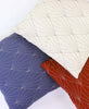 Red, white, and blue modern throw pillows with geometric art deco patterns