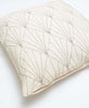 Ivory modern throw pillow with geometric art deco pattern