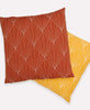 pair of rust and mustard yellow hand embroidered modern throw pillows with removable down feather inserts