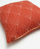 art deco hand-embroidered throw pillow made from fair trade organic cotton in rust orange
