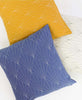group of organic cotton array throw pillows, yellow and blue