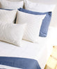 modern boho all white pillow arrangement
