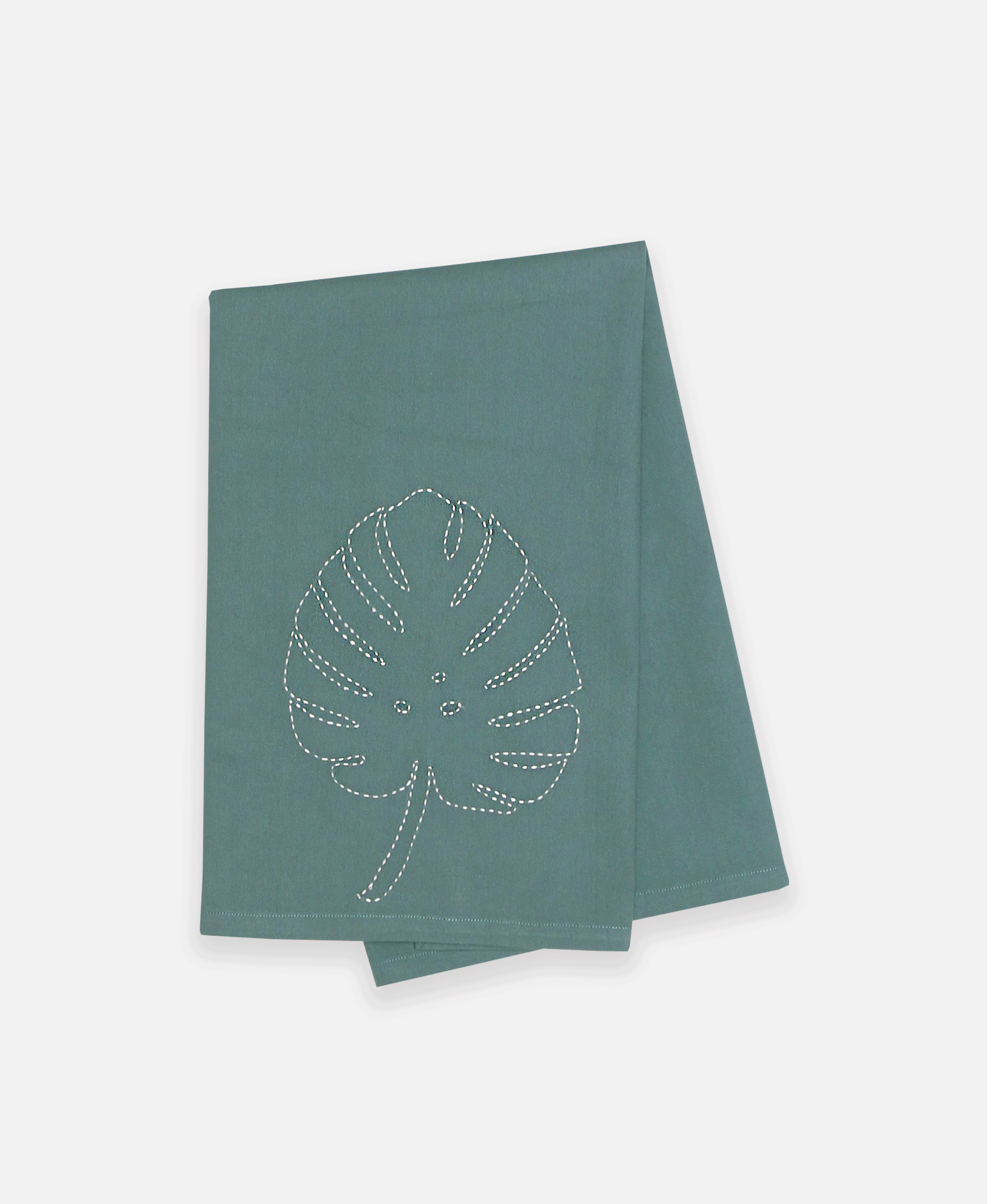 Blue/green folded tea towel featuring unique hand stitched palm patterns