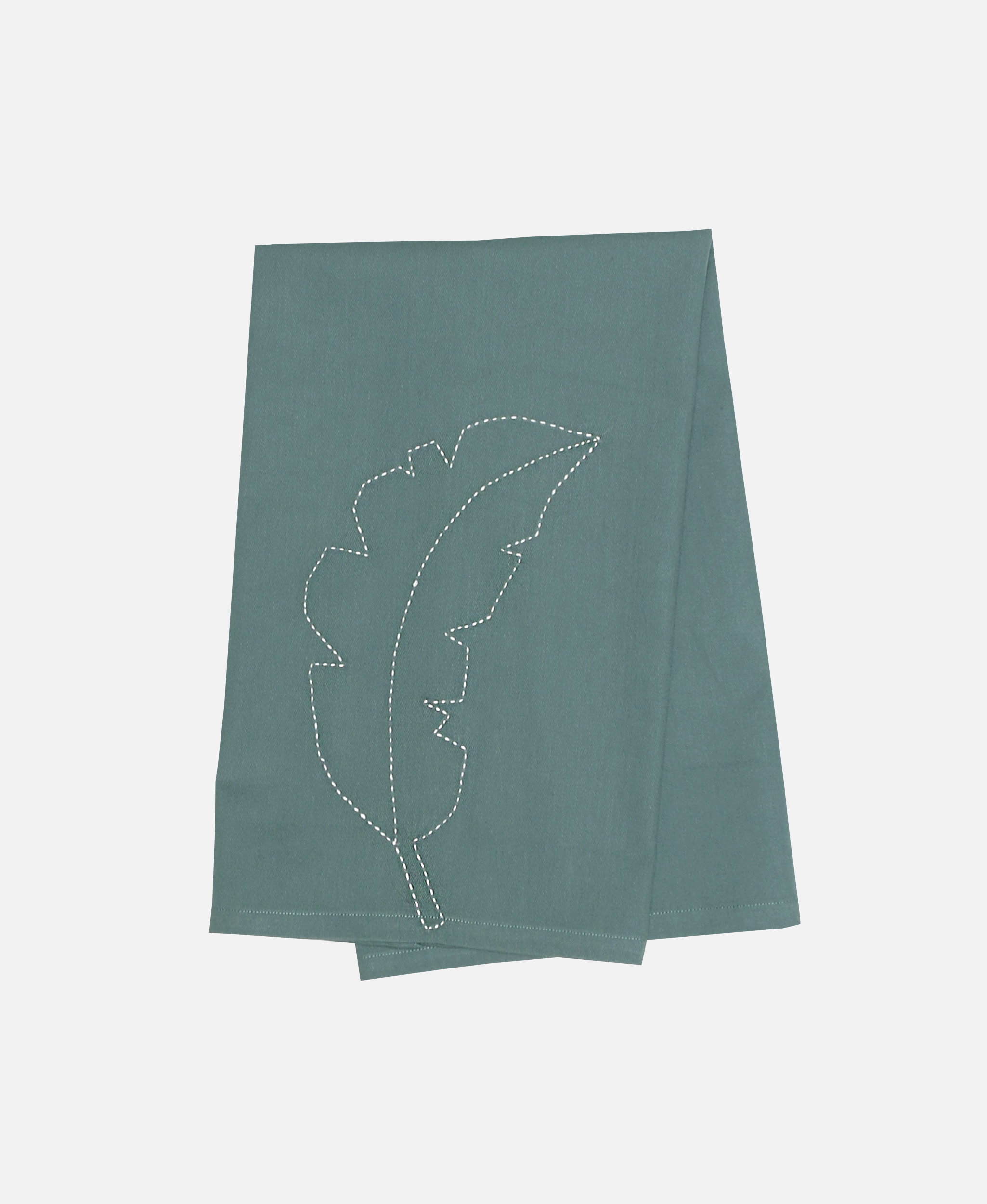 Blue/green folded tea towel with white leaf pattern sewn into organic cotton fabric