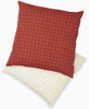 sustainably made accent pillow in rust red with small modern cross-stitching