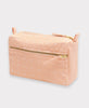 pale pink small toiletry bag with cross-stitch pattern details