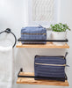 organic cotton toiletry bags on bathroom shelf by Anchal Project