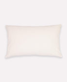 solid white backing of curve lumbar pillow in mustard yellow