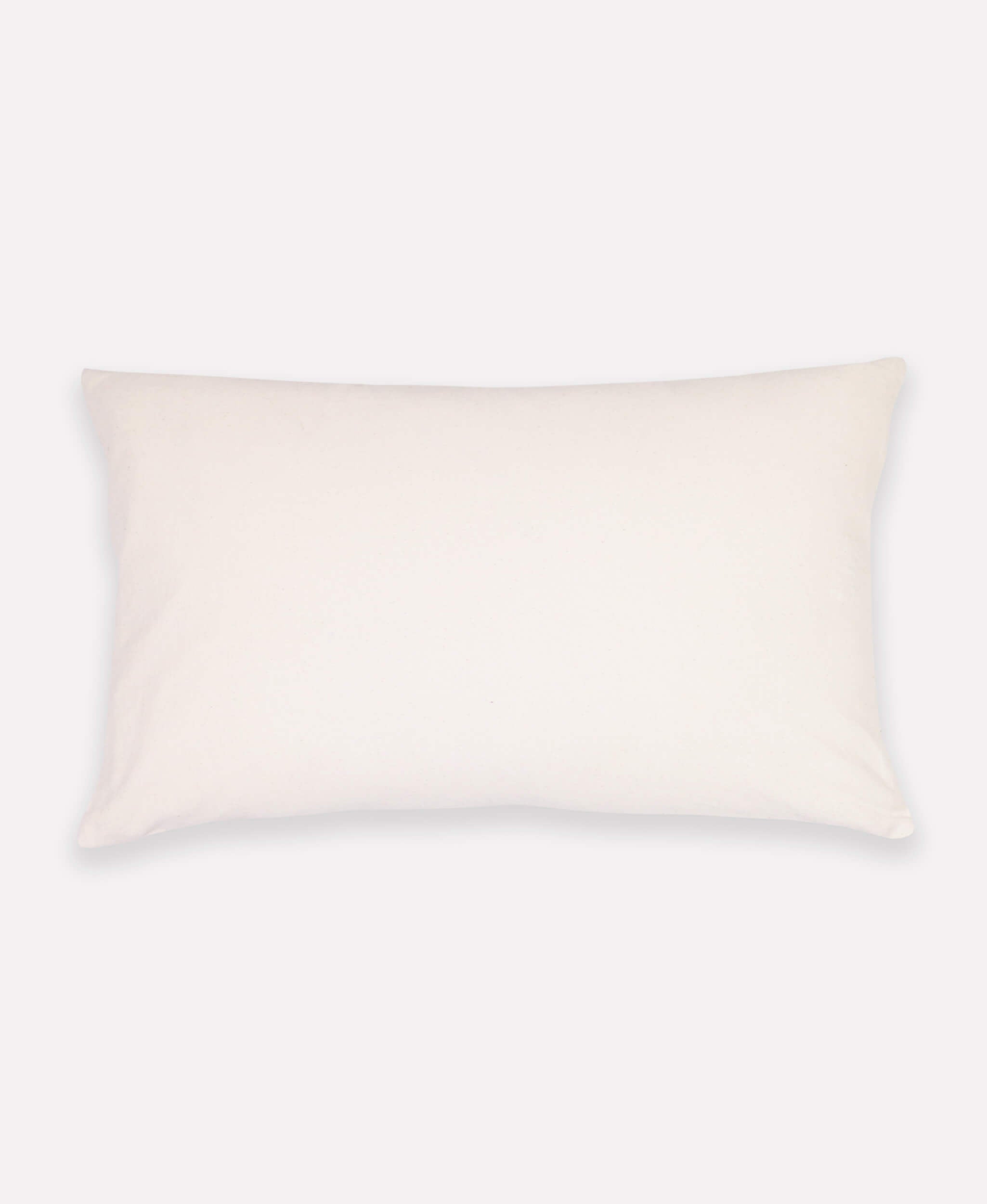 solid white backing of curve lumbar pillow in mustard yellow