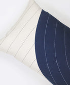 organic cotton lumbar pillow in navy blue and natural white with black kantha embroidery