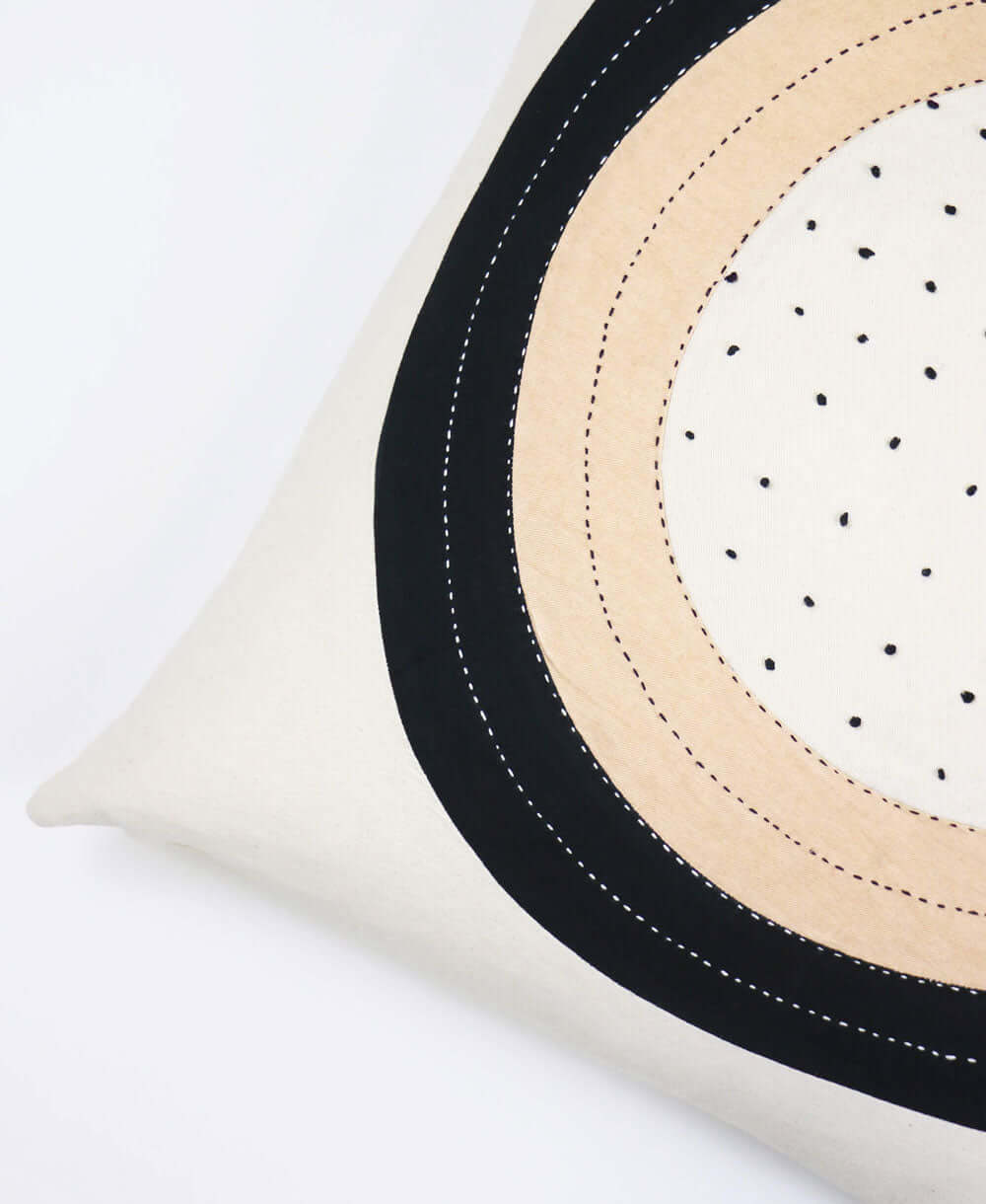 throw pillow with hand-embroidery and french knots with modern lunar design