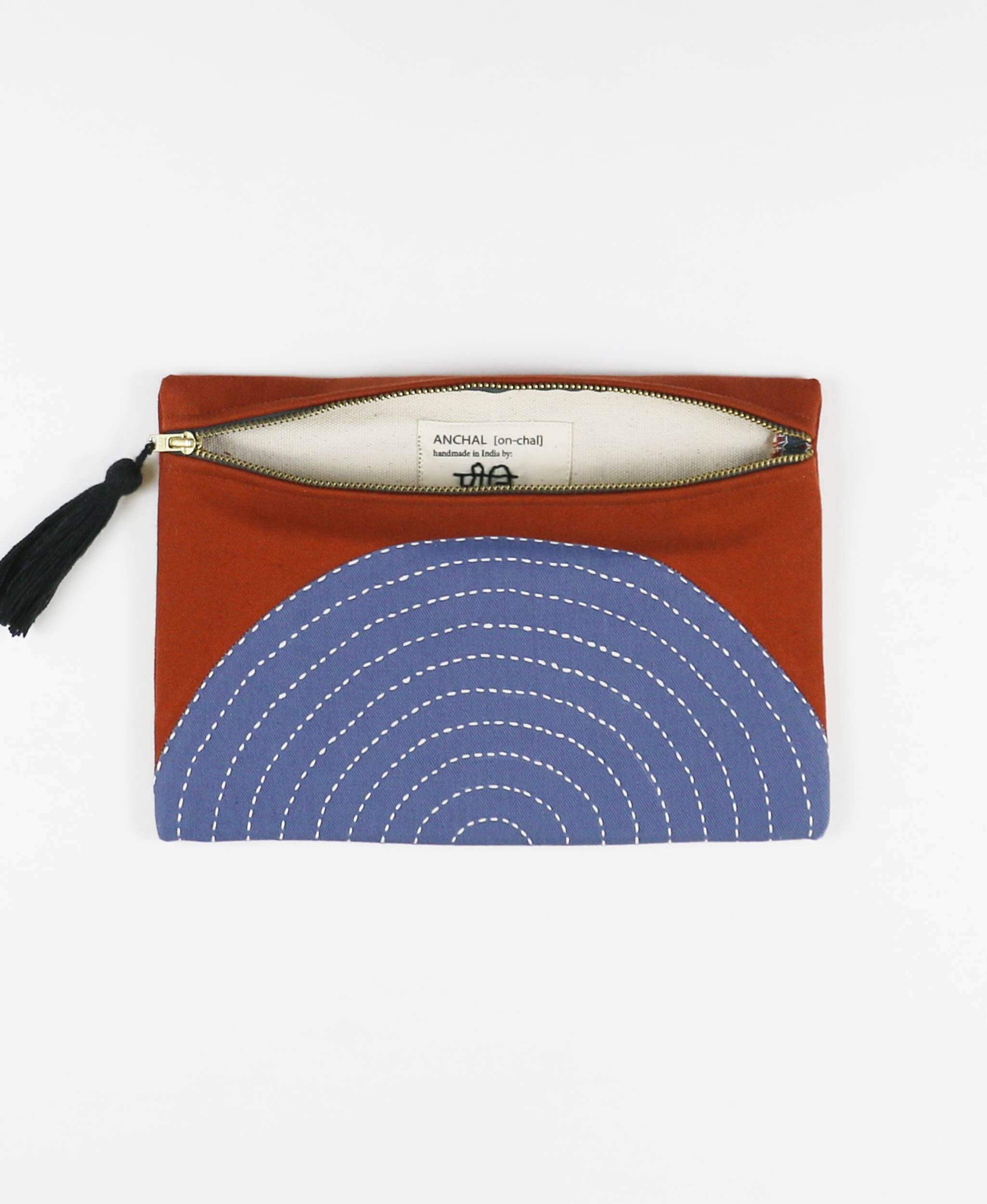 Fair Trade zippered clutch with eclipse design in rust