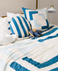 cobalt blue and sky blue modern quilt on all white full size bed by Anchal Project
