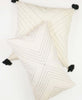 bone ivory throw pillows with arrow embroidery with tassels by Anchal