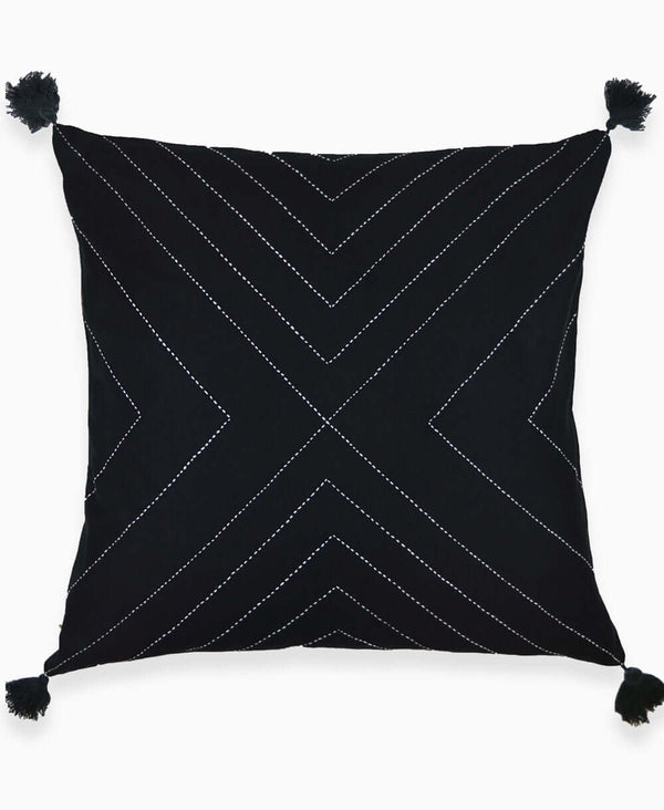 Geometric throw pillow with detailed hand stitching and tassels