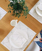Ivory graph placemat set showcased with matching napkin set on a wooden dinner table