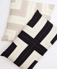 pair of coordinating interlock throw pillows in charcoal and oxford tan by Anchal