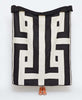 White organic cotton quilt featuring dark brown geometric design