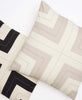 interlock throw pillows pairing with charcoal and oxford tan colorways