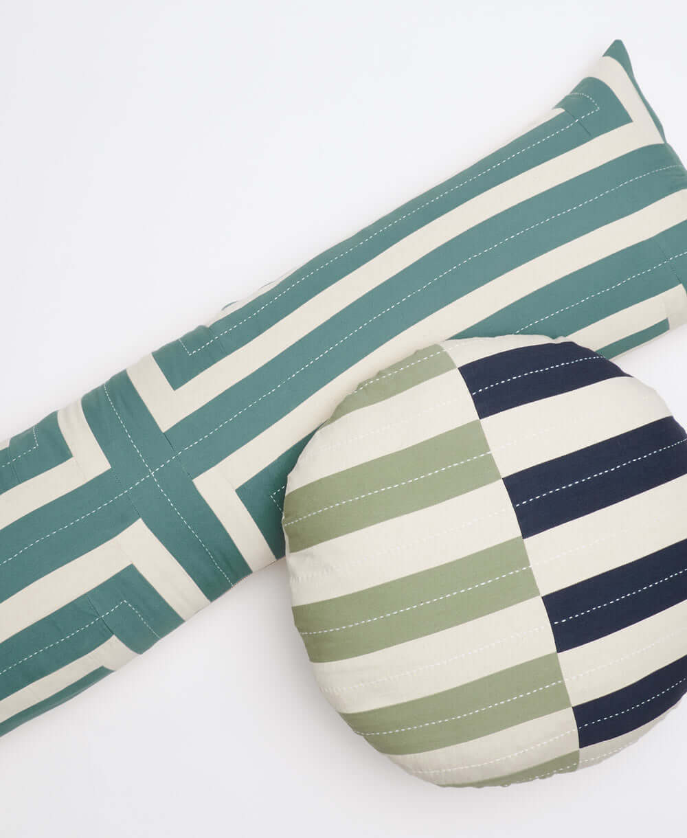 spruce green interlock long lumbar pillow paired with round offset throw pillow by Anchal Project