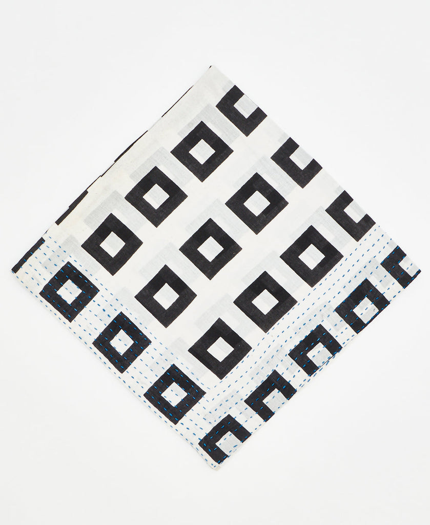white cotton bandana with bold black squares and blue traditional kantha stitching