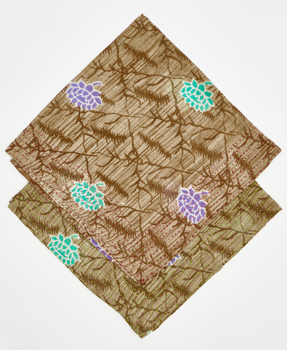 2 brown bandanas with teal and purple flowers, dark brown diamond pattern, and traditional kantha stitching stacked on top of each other to show the difference in thread colors