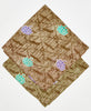 2 brown bandanas with teal and purple flowers, dark brown diamond pattern, and traditional kantha stitching stacked on top of each other to show the difference in thread colors