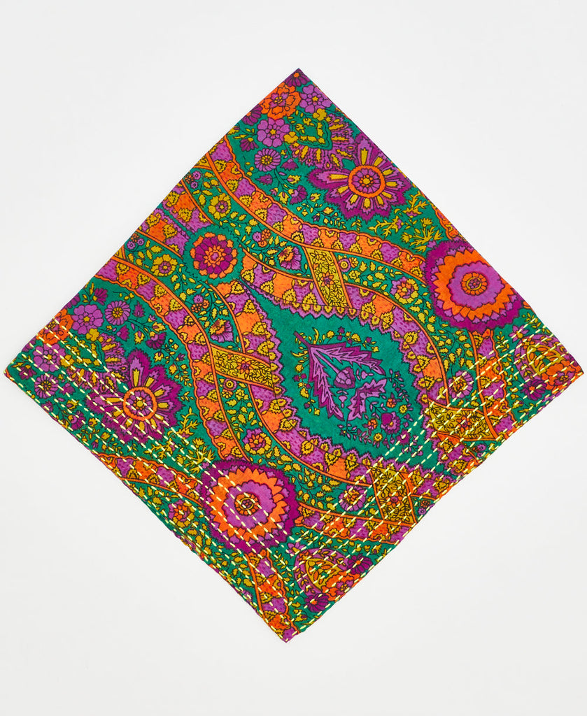 green bandana with bright multicolored paisleys and flowers with orange, purple, and yellow details and white kantha stitching 