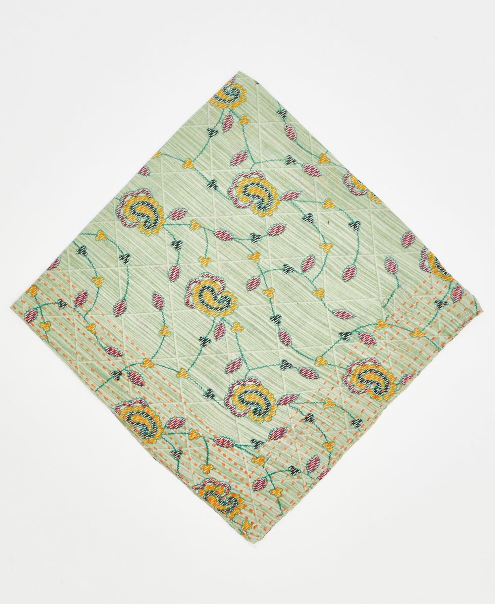 pale green bandana with light grid pattern and red and yellow paisleys and vines with orange traditional kantha stitching 