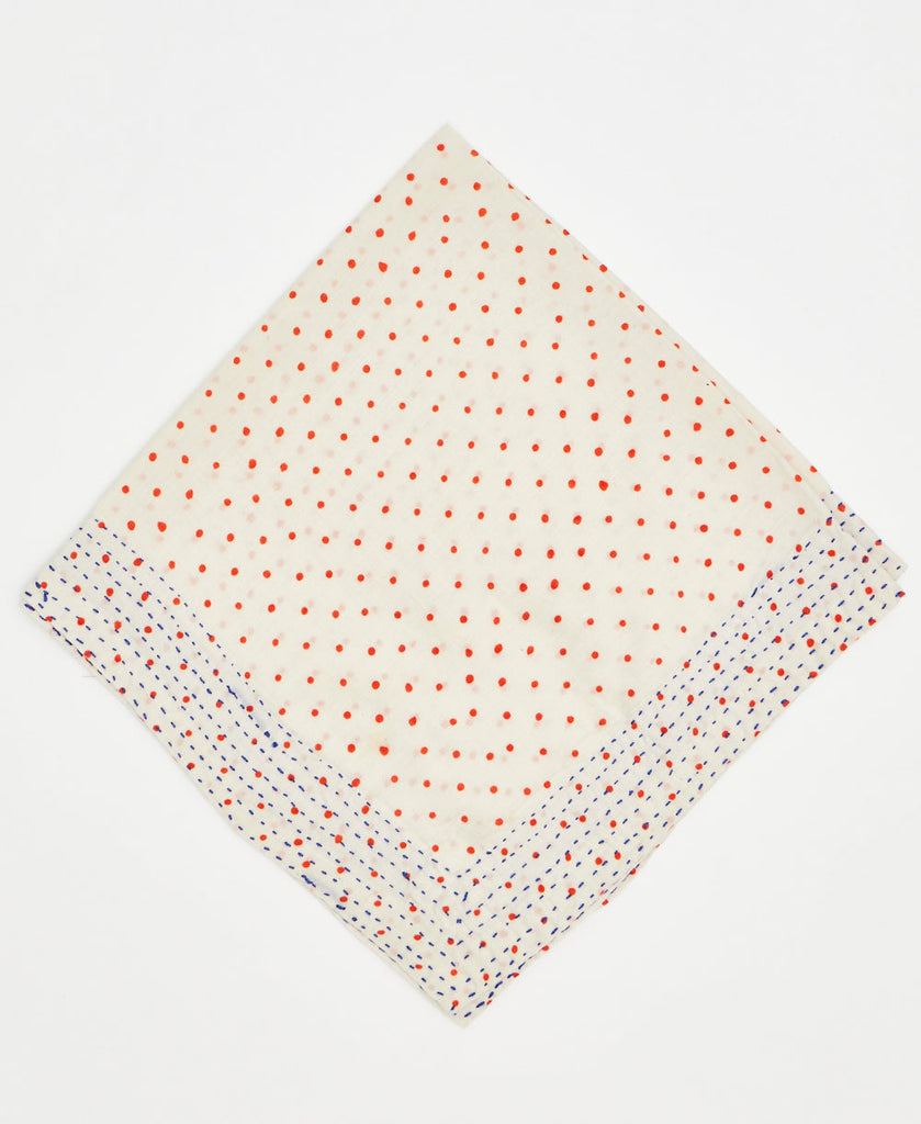 white cotton bandana with orange polka dots and blue kantha stitching along its edges