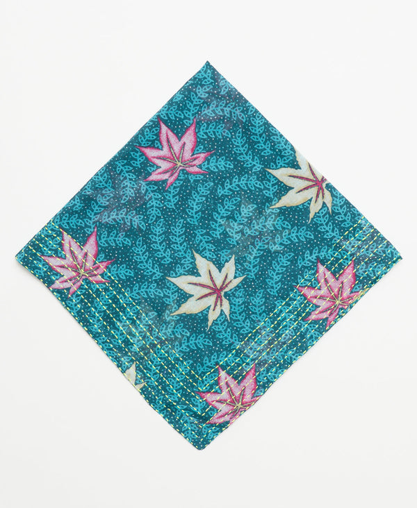 teal cotton bandana with beige and pink leaves and a light blue vine pattern and yellow kantha stitching