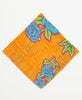 bright yellow bandana with orange geometric patterns and blue roses and dark blue kantha stitching