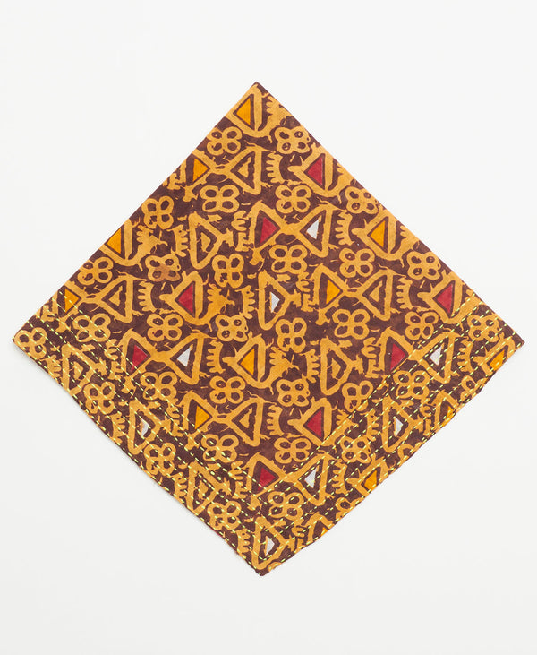 brown cotton bandana with red, orange, and yellow triangles and neon yellow kantha stitching