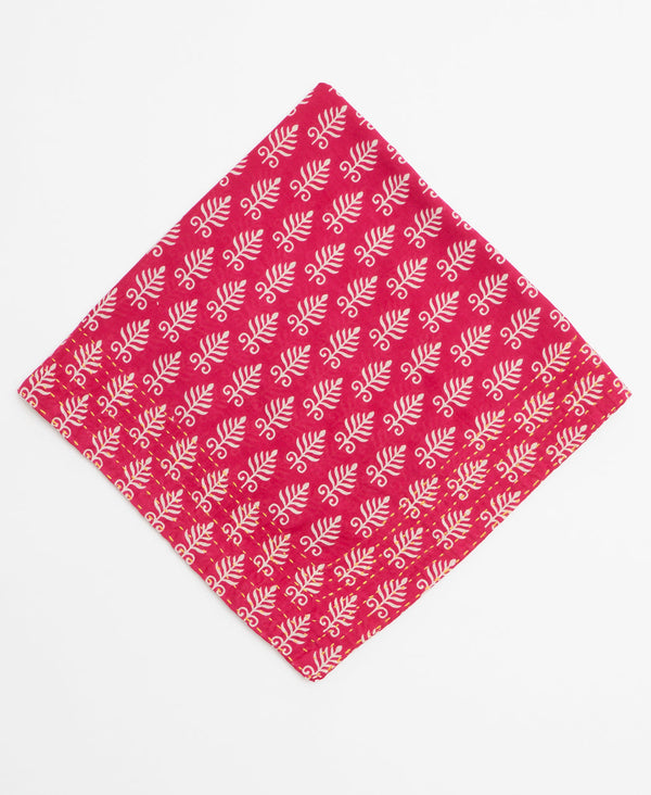 Hot pink bandana featuring a white pattern throughout and kantha stitching 