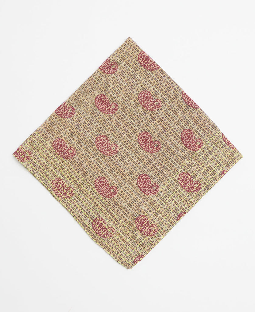Brown bandana featuring a red paisley pattern and yellow kantha stitching 