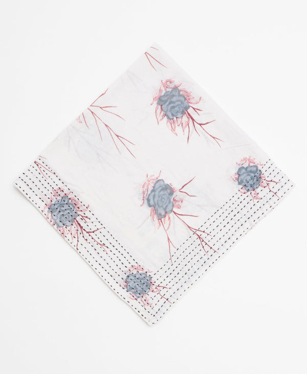 White bandana featuring a minimal grey and red floral pattern 