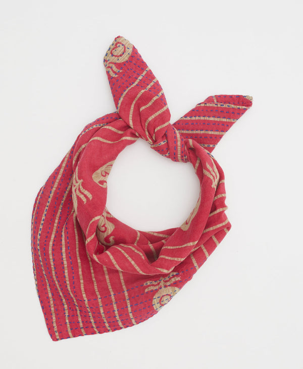 Red vintage cotton bandana featuring a tan striped and abstract pattern 