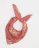 red artisan made bandana featuring a yellow floral pattern 