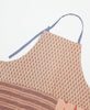 Muted small print tie detail apron featuring three large pockets