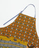Colorful tie detail apron featuring three large pockets 