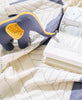 slate blue stuffed elephant toy and matching slate blue triangle quilt throw by Anchal Project